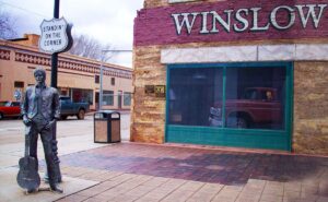 Winslow pays homage to the song that pinned the town on the map of pop culture with this art display featuring a young man with a guitar standing on the corner being checked out by a pretty girl. Photo: Carolyn Burns Bass