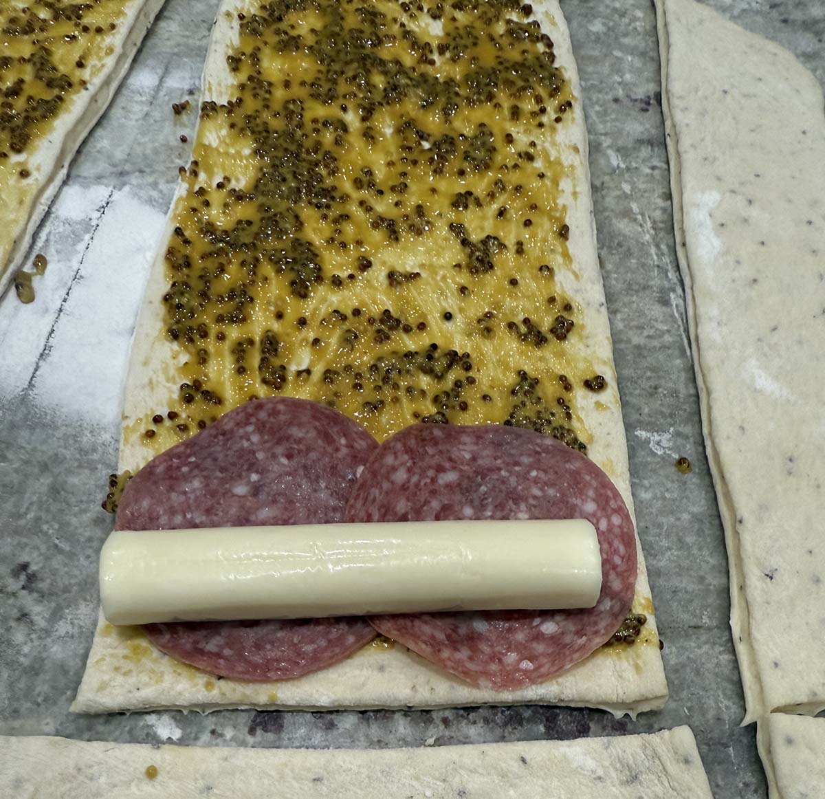 Add salami and string cheese to prepared bread dough.