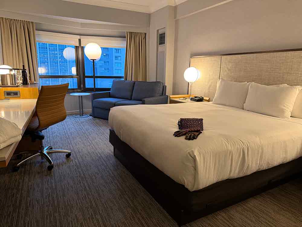King guest room offers space to work, comfortable beds, and wide window views.